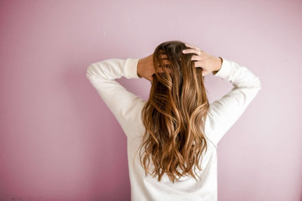 girl with hands in long hair