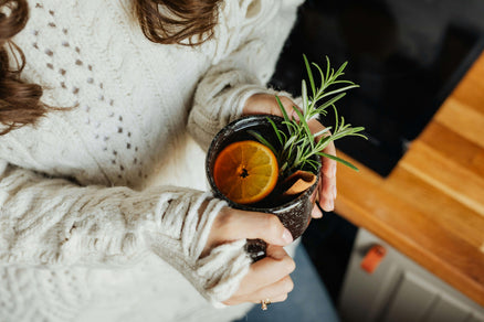 person holding fall drink