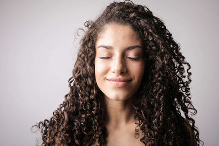 woman healthy hair and long curls