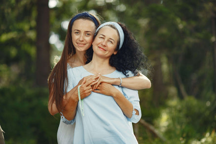 mother and daughter smiling at camera