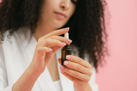 Woman using hair oil