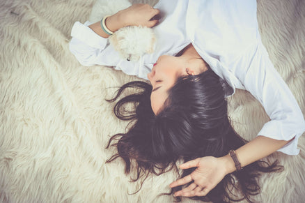person lying down and practicing self-care
