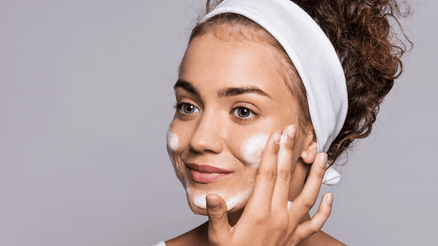 Woman using skincare on her face