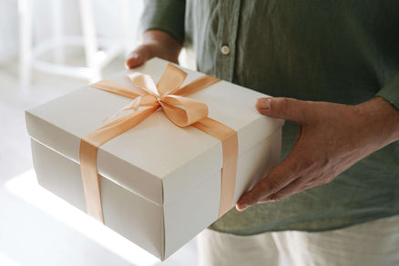 man holding a gift box