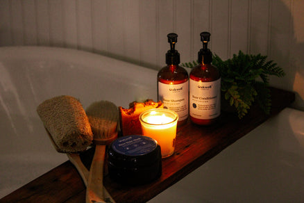 bath with lit candle and bath products