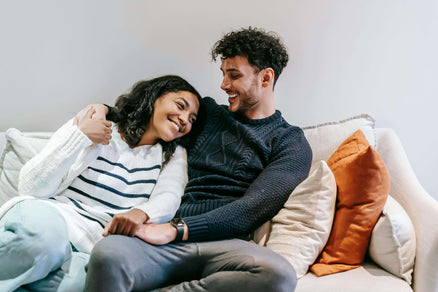 Couple on the couch together smiling