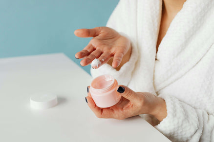 woman with lotion on hand for dry skin